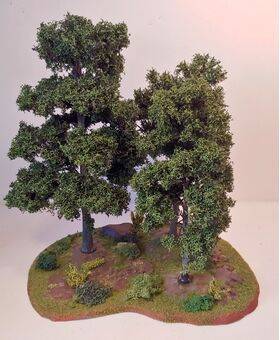 Wargaming terrain, shown with 8"& 6" trees
